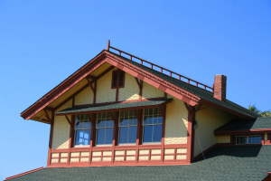 A tinted window on the second storey of the house